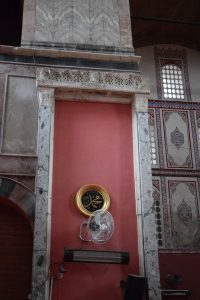 Icon frame on the north side of the church. The arched (former) entrance to the prothesis can be seen at lower left