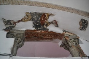 Remains of fresco over the nave entrance.