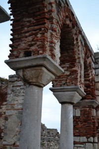The exposed brickwork of the arch provides a contrast to the graceful columns