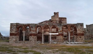 Western facade of the exonarthex. Arrow indicates remains of Theotokos fresco.