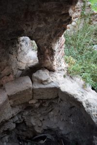 Curved structure in stone foundation