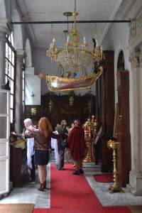 meryem-2 Worshippers gathering and lighting candles in the narthex.