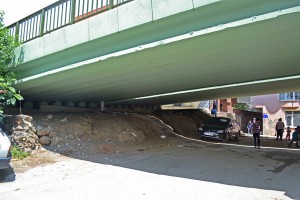 The road bridge with a tiny section of masonry visible underneath