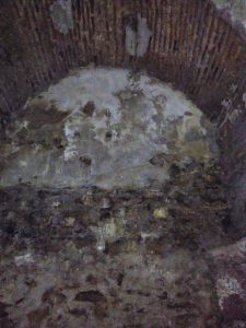 Remains of fresco decoration in an arch off the main vault
